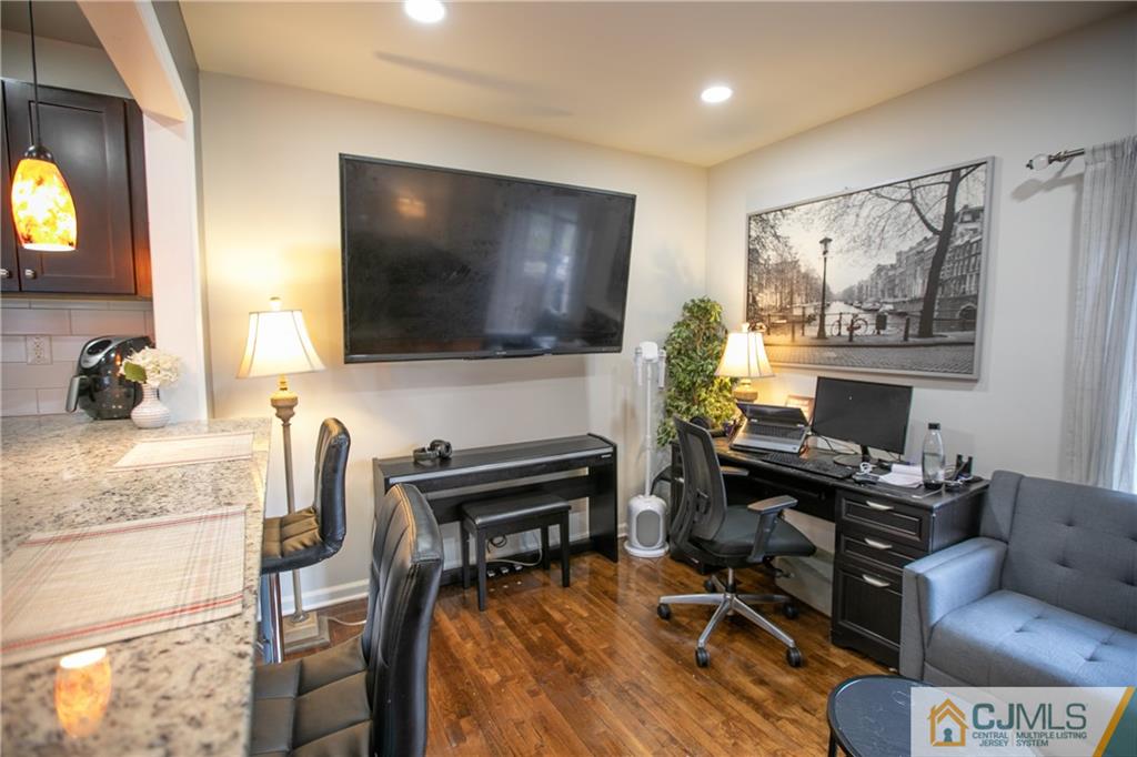 4308 Hana Road Edison, NJ 08817 - Photo 9 of 32 a living room with furniture and a flat screen tv
