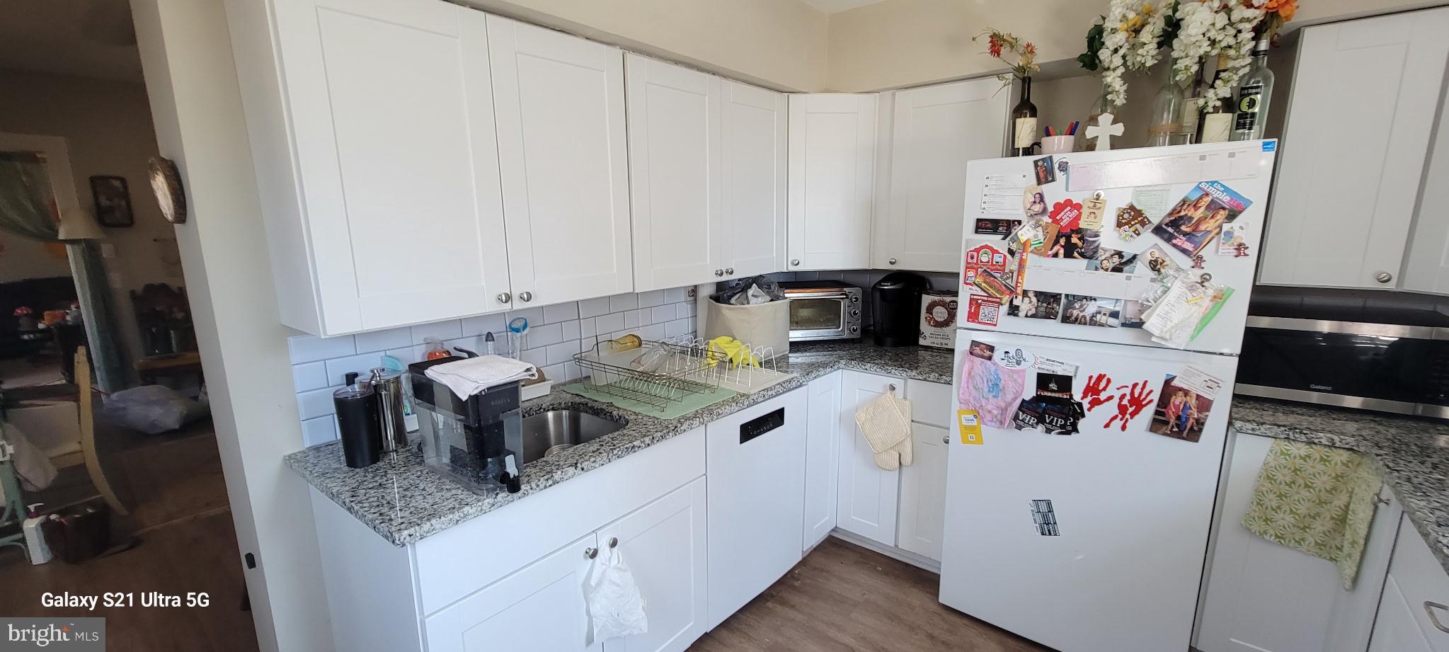 138 3rd Street, Unit 1 Bridgeport, PA 19405 - Photo 3 of 9 a kitchen with a refrigerator and sink