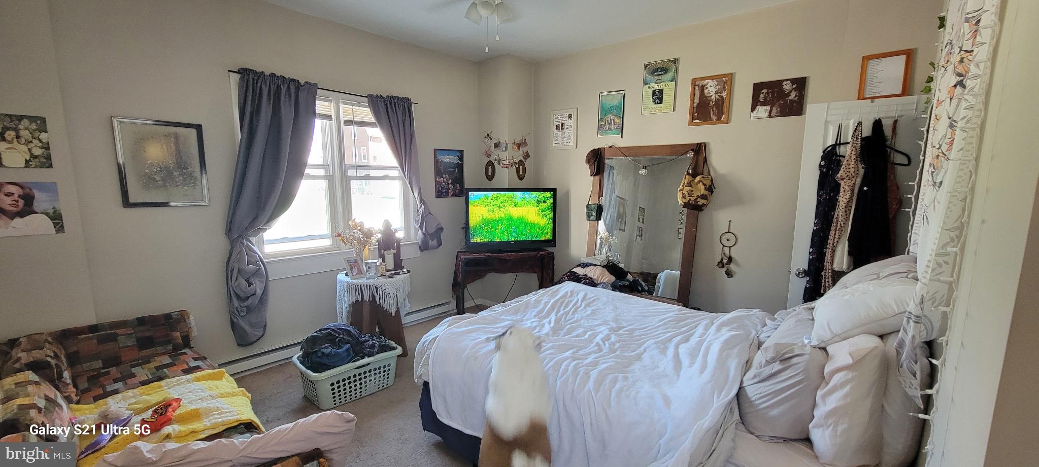 138 3rd Street, Unit 1 Bridgeport, PA 19405 - Photo 6 of 9 a bed room with a bed window and a chair
