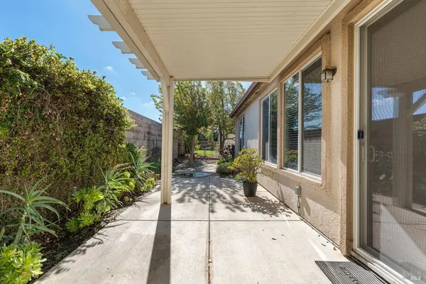 a view of a house with a small yard