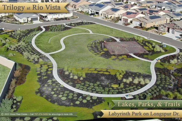 a view of a park with welcome board