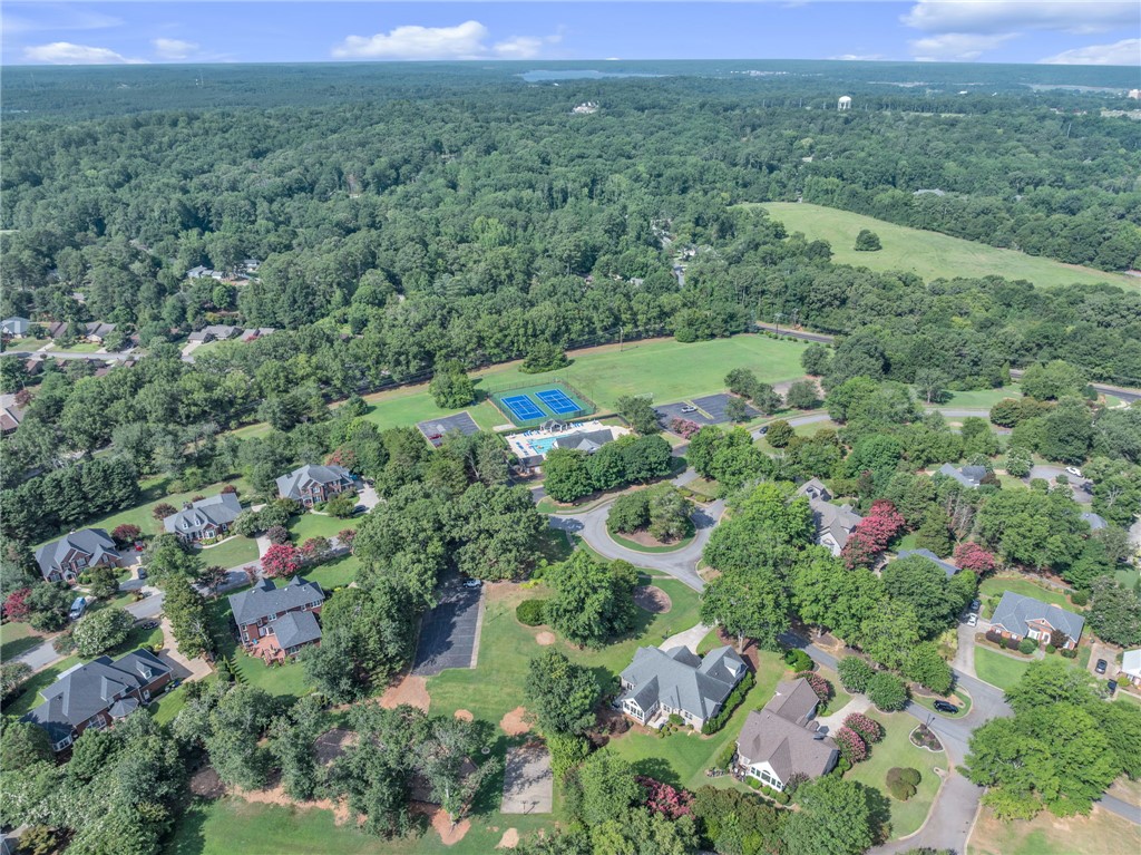 102 Country Walk Lane Clemson, SC 29631 - Photo 34 of 39 An aerial panorama reveals a community offering tennis courts and a refreshing pool, nestled among verdant homes.