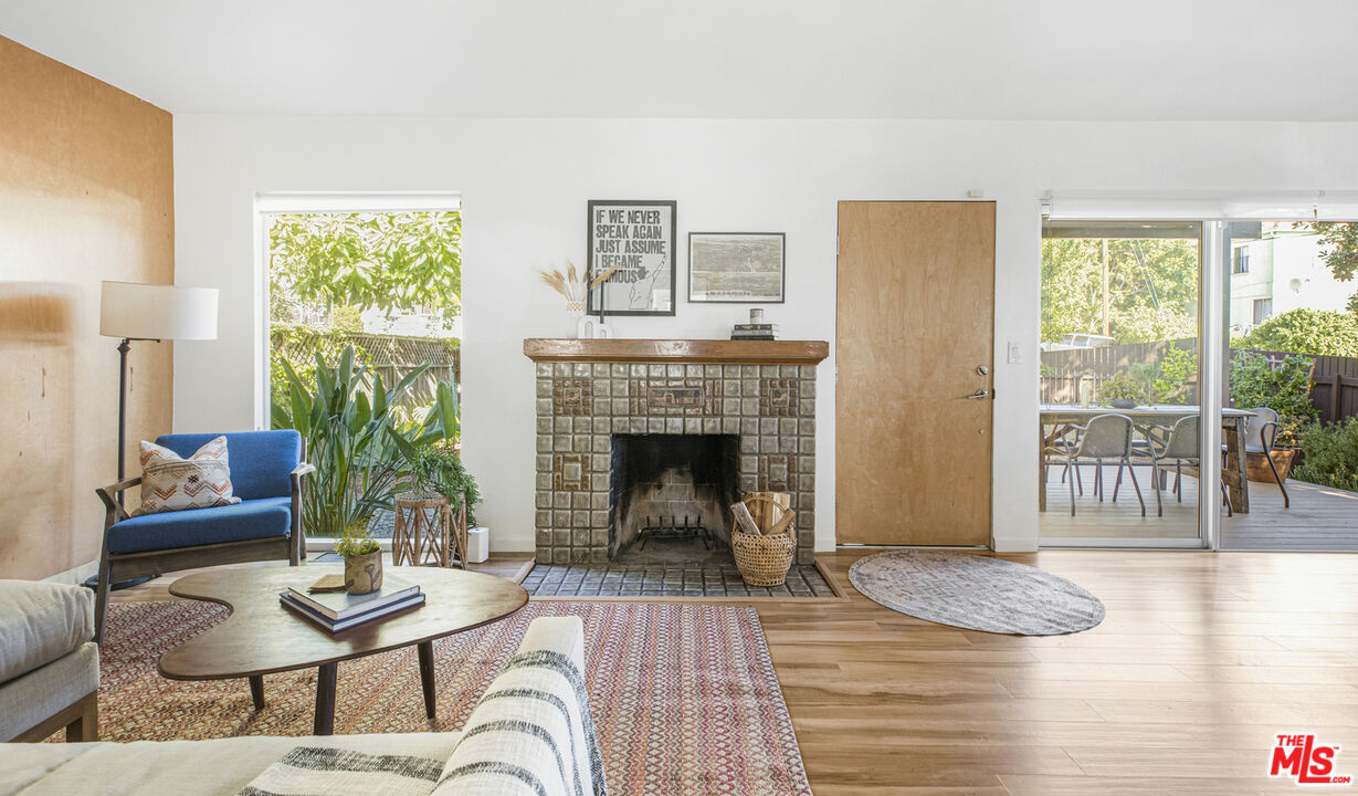 5740 Meridian Street Los Angeles, CA 90042 - Photo 14 of 50 a living room with furniture and a fireplace