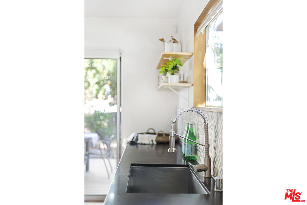 5740 Meridian Street Los Angeles, CA 90042 - Photo 24 of 50 a living room with furniture and a rug