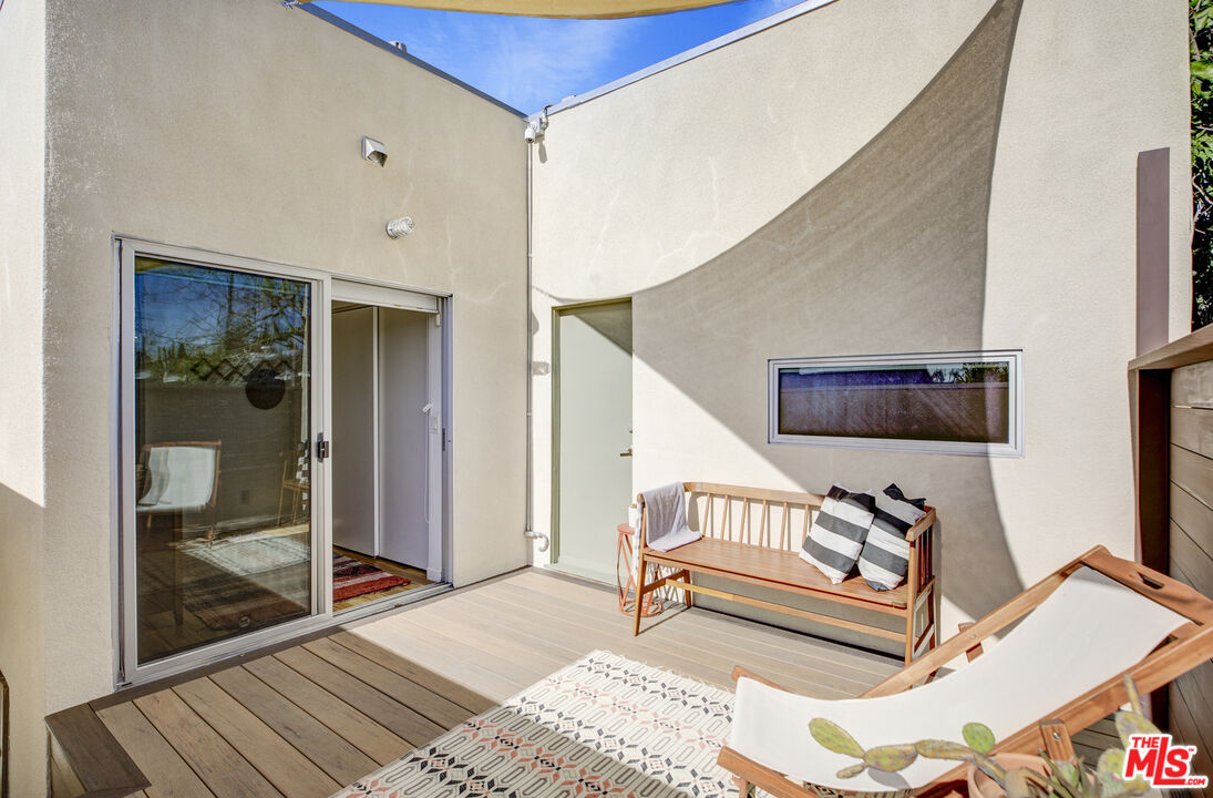 5740 Meridian Street Los Angeles, CA 90042 - Photo 38 of 50 a bedroom with furniture and a window
