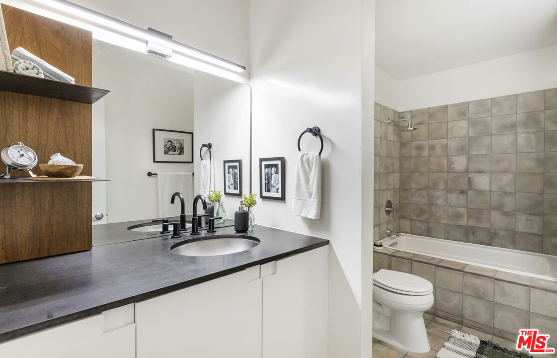 5740 Meridian Street Los Angeles, CA 90042 - Photo 44 of 50 a bathroom with a sink a toilet and shower