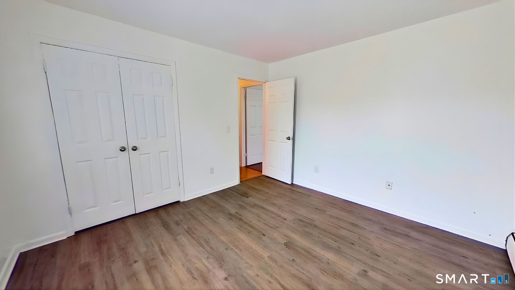 72 Chestnut Street, Unit 6 Norwalk, CT 06854 - Photo 13 of 14 a view of an empty room with wooden floor