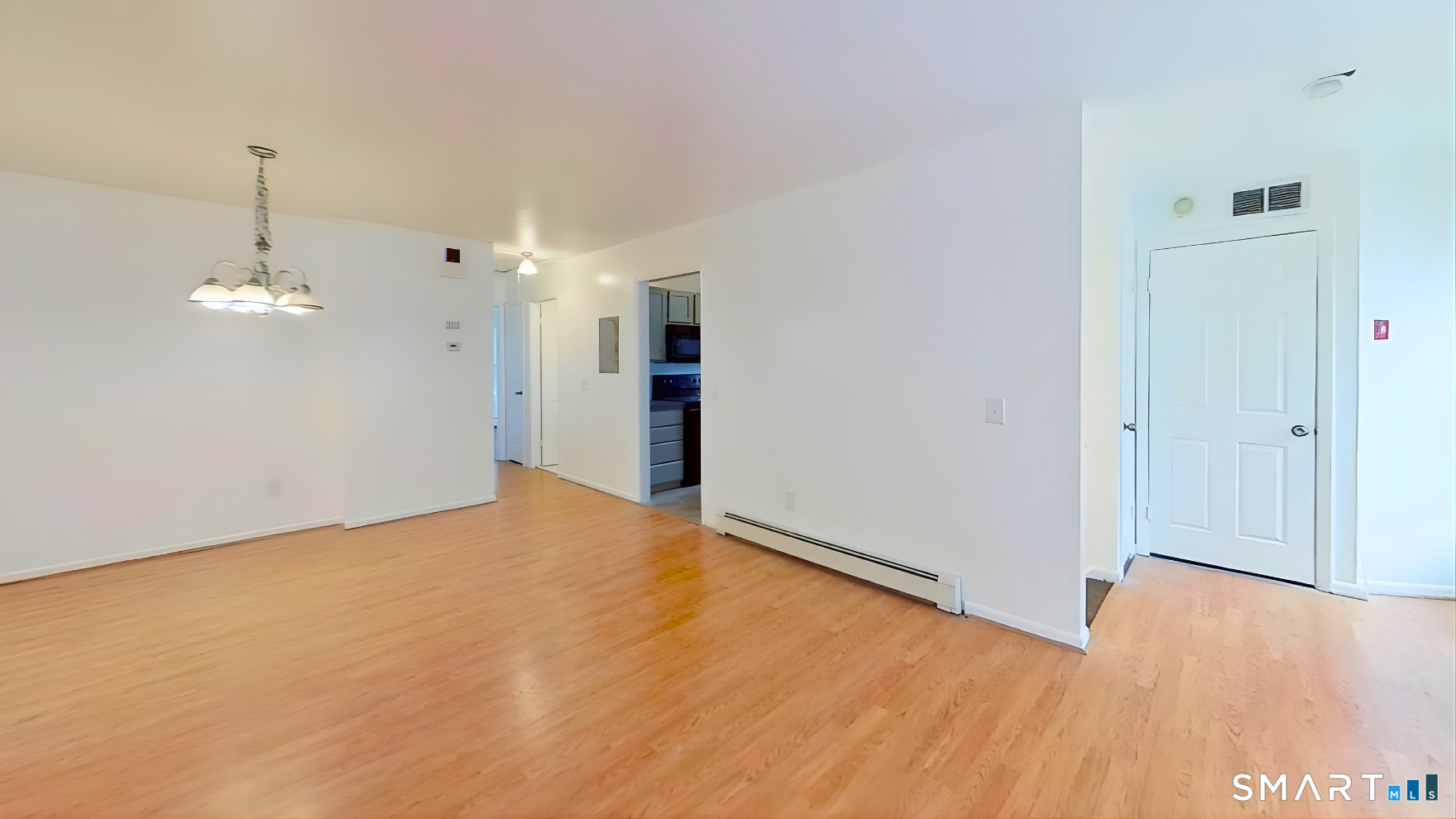 72 Chestnut Street, Unit 6 Norwalk, CT 06854 - Photo 4 of 14 a view of empty room with wooden floor