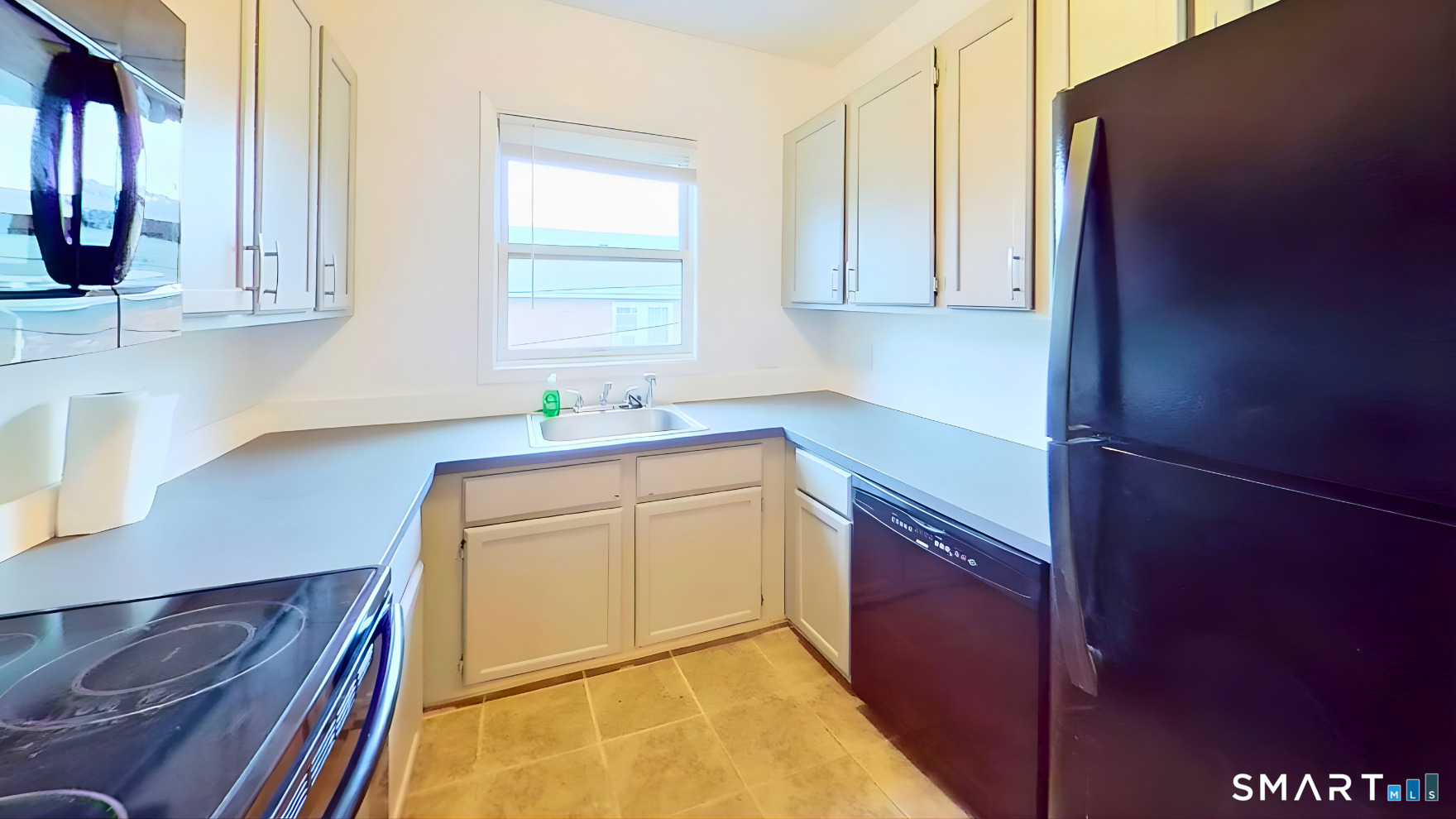 72 Chestnut Street, Unit 6 Norwalk, CT 06854 - Photo 8 of 14 a kitchen with stainless steel appliances granite countertop a sink stove and cabinets