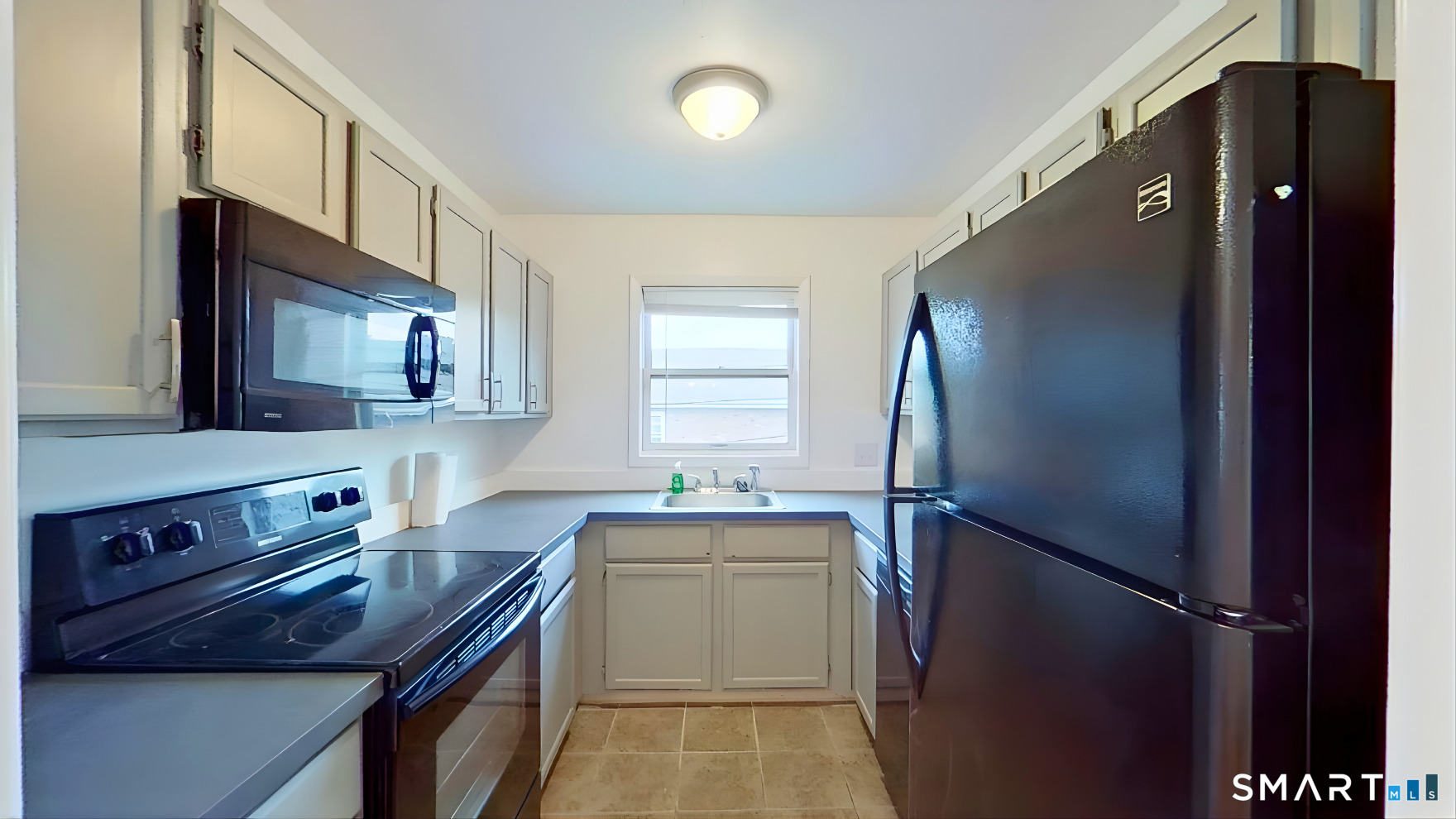72 Chestnut Street, Unit 6 Norwalk, CT 06854 - Photo 9 of 14 a kitchen with a sink appliances and cabinets