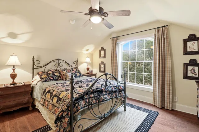 a bedroom with bed and a window