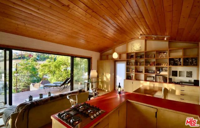 a room with furniture and a large window