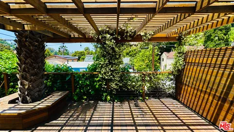 a view of a porch with wooden floor