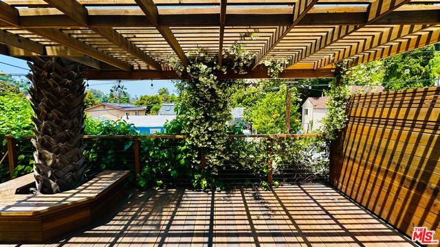 a view of a porch with wooden floor