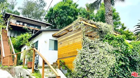 a bathroom with a tub and a shower
