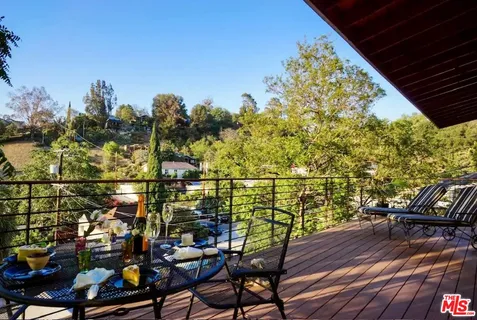 a view of a chairs and table on the wooden floor