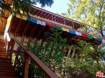 a kitchen with stainless steel appliances granite countertop a sink and a refrigerator
