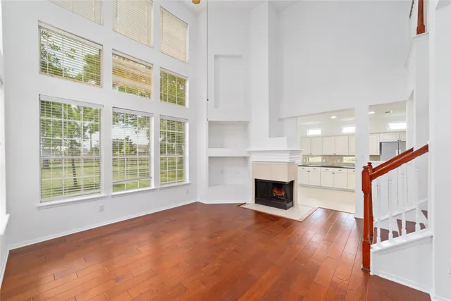 a view of livingroom with furniture fireplace and window