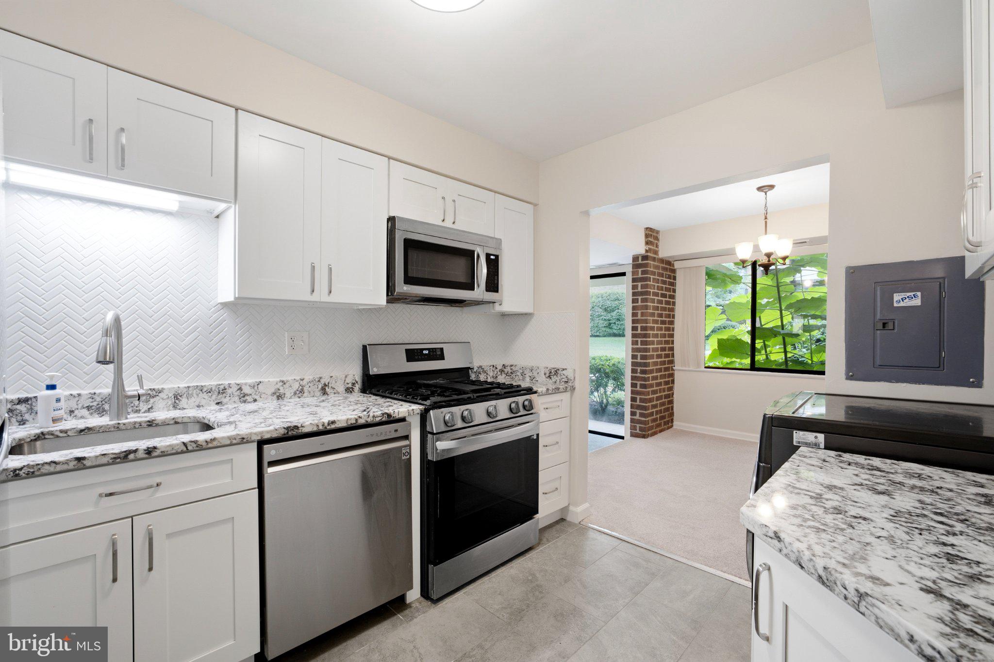 2005 Coleridge Drive, Unit 13101 Silver Spring, MD 20902 - Photo 7 of 16 Modern kitchen with sleek finishes.