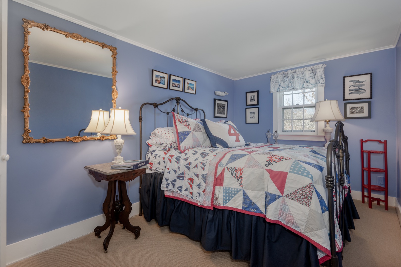 42 North Liberty Street Nantucket, MA 02554 - Photo 18 of 20 a bedroom with a bed and dresser