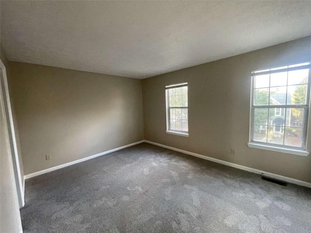 3774 Meadow Creek Drive, Unit 3774 Norcross, GA 30092 - Photo 11 of 29 an empty room with windows