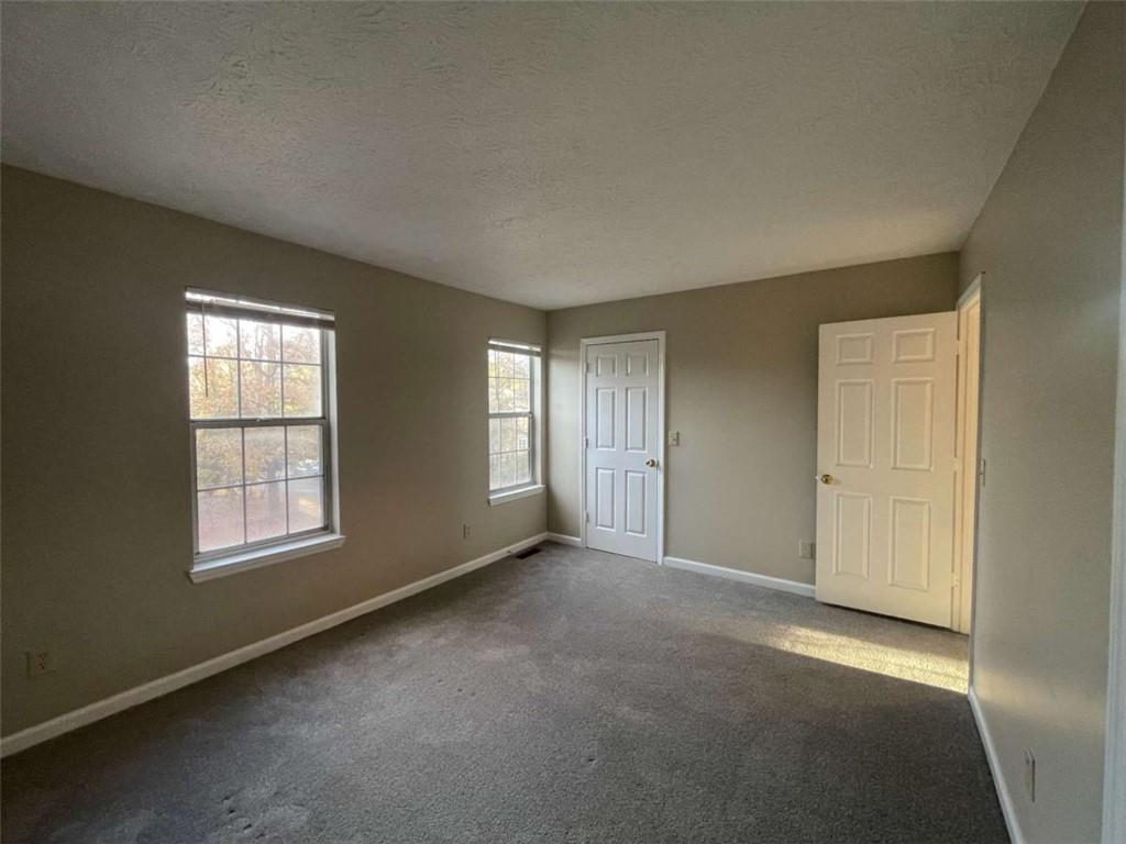 3774 Meadow Creek Drive, Unit 3774 Norcross, GA 30092 - Photo 14 of 29 an empty room with windows