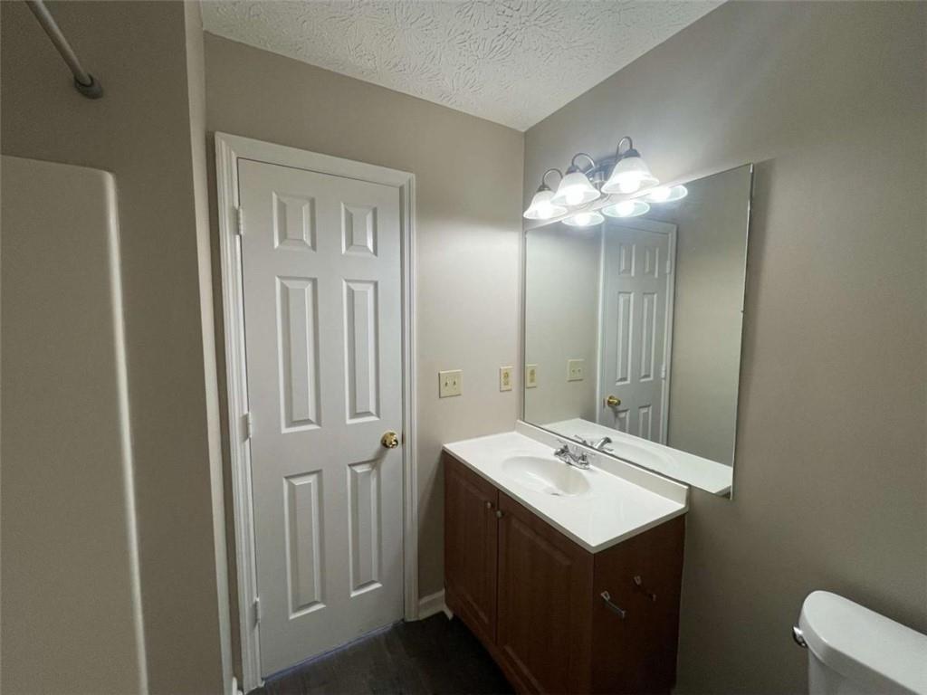 3774 Meadow Creek Drive, Unit 3774 Norcross, GA 30092 - Photo 17 of 29 a bathroom with a sink vanity and mirror