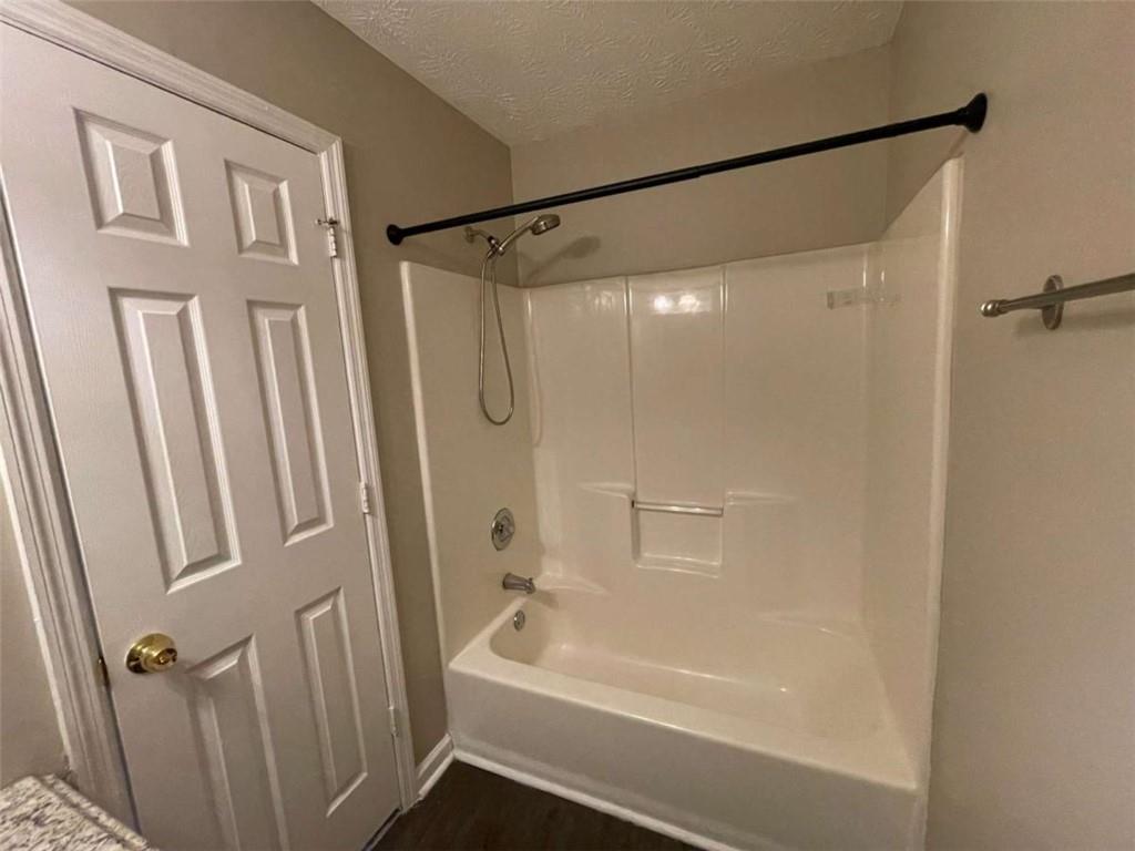 3774 Meadow Creek Drive, Unit 3774 Norcross, GA 30092 - Photo 21 of 29 a bathroom with a shower and a bath tub