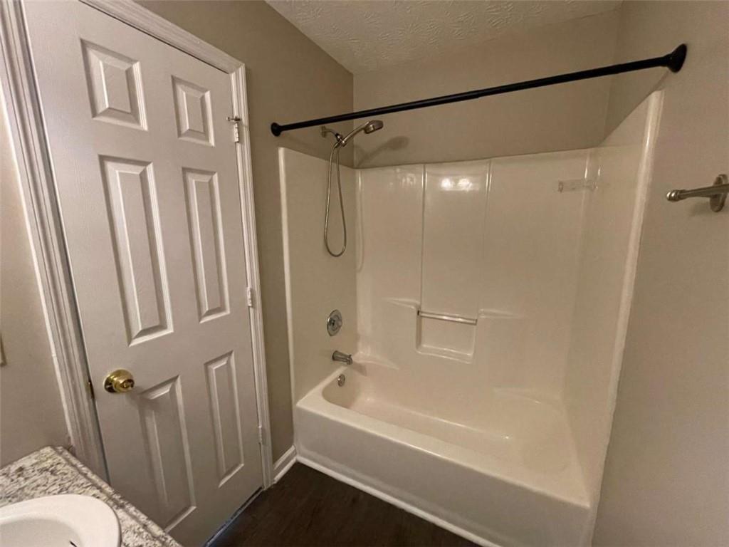 3774 Meadow Creek Drive, Unit 3774 Norcross, GA 30092 - Photo 22 of 29 a bathroom with a bathtub and a shower
