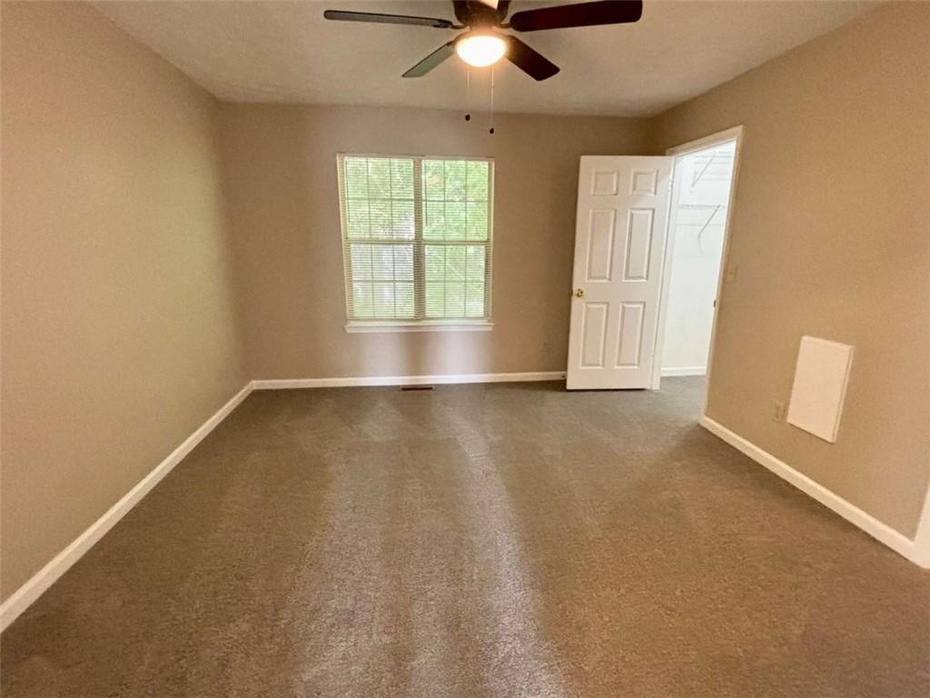3774 Meadow Creek Drive, Unit 3774 Norcross, GA 30092 - Photo 23 of 29 wooden floor in an empty room with a window