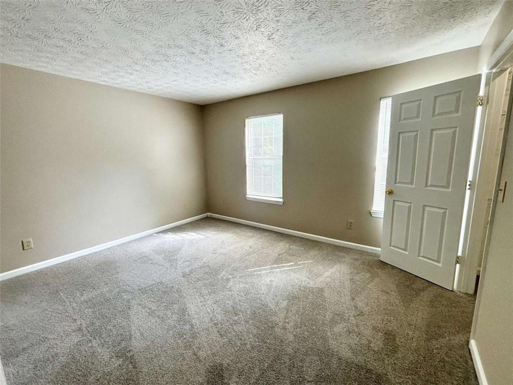 3774 Meadow Creek Drive, Unit 3774 Norcross, GA 30092 - Photo 26 of 29 an empty room with windows