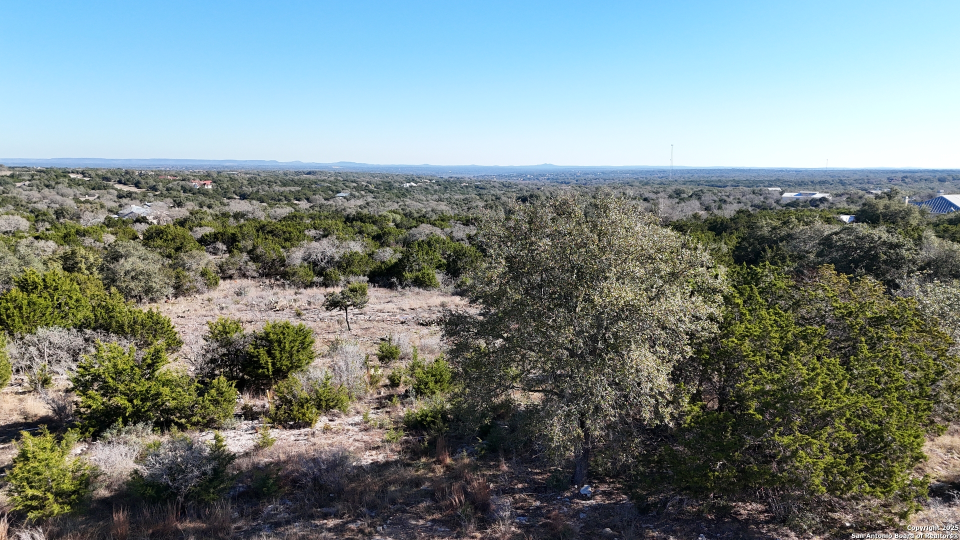 4 Meridian Boerne, TX 78006 - Photo 11 of 13 an aerial view of house with yard and mountain view in back