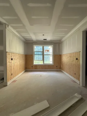 a view of an empty room with empty shelves