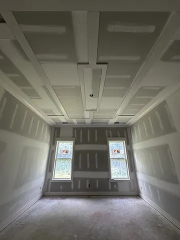 an empty room with windows