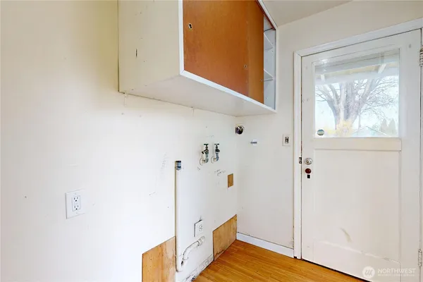 a view of an entryway with wooden floor