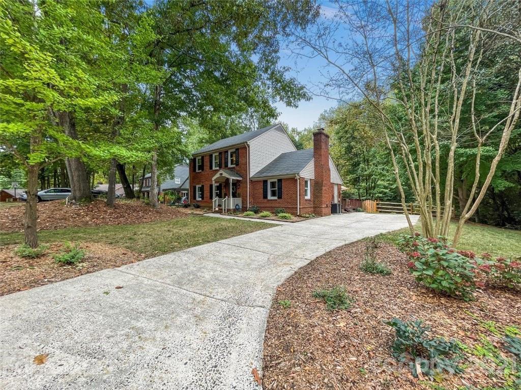 733 Neill Ridge Road Matthews, NC 28105 - Photo 2 of 30 a front view of a house with a yard