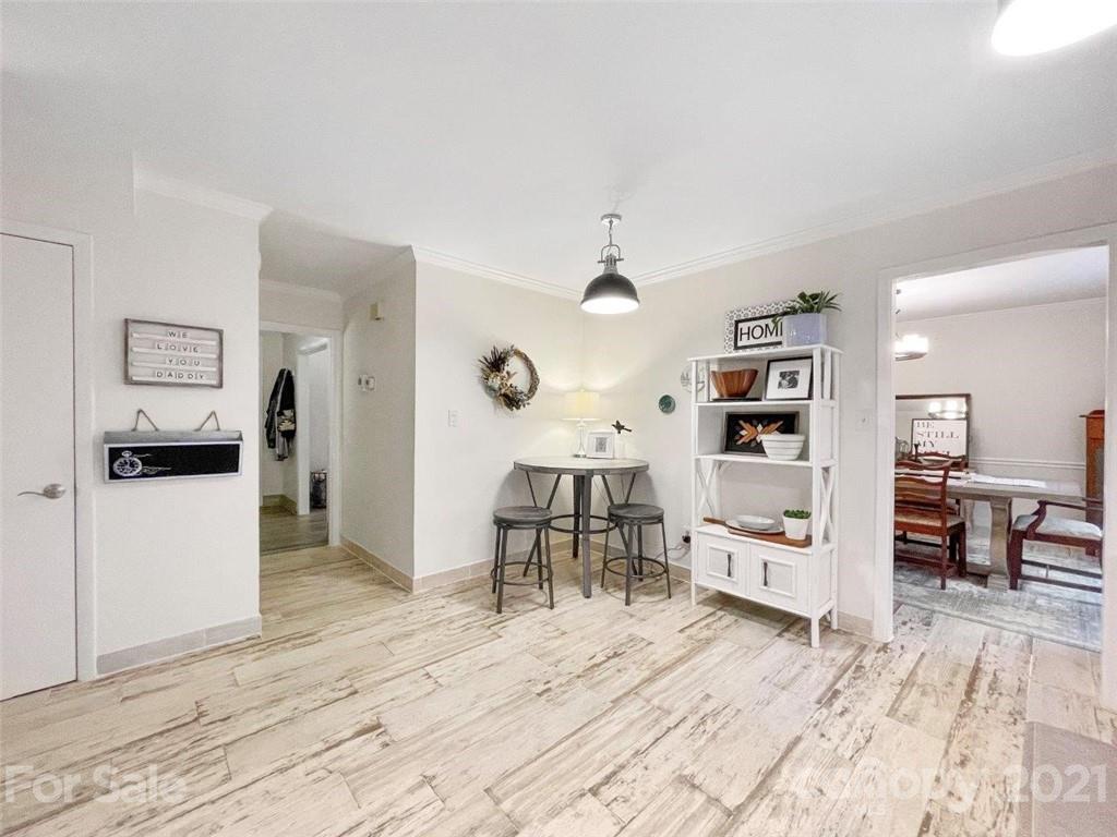 733 Neill Ridge Road Matthews, NC 28105 - Photo 11 of 30 a living room with furniture and a wooden floor
