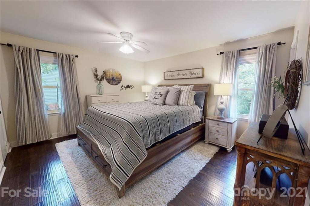 733 Neill Ridge Road Matthews, NC 28105 - Photo 17 of 30 a bedroom with a bed and a flat tv screen on a dresser