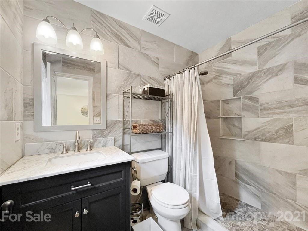733 Neill Ridge Road Matthews, NC 28105 - Photo 19 of 30 a bathroom with a sink vanity mirror and toilet