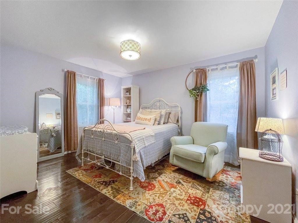 733 Neill Ridge Road Matthews, NC 28105 - Photo 20 of 30 a bedroom with a bed and a couch