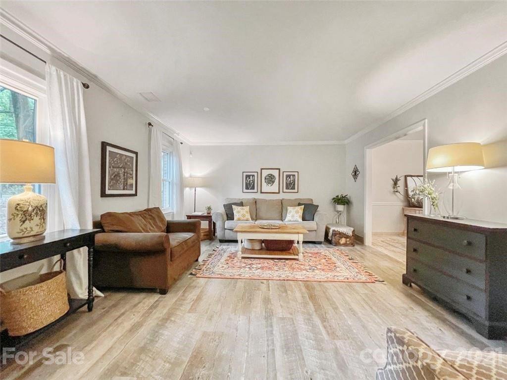 733 Neill Ridge Road Matthews, NC 28105 - Photo 3 of 30 a living room with furniture and a dresser