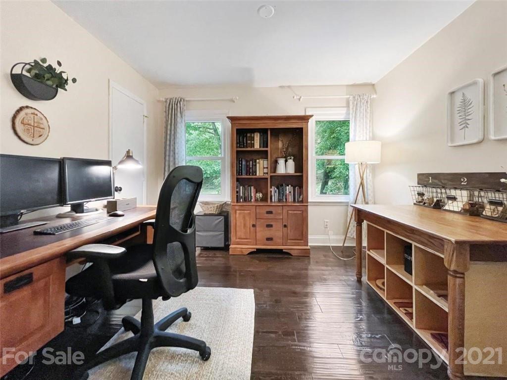733 Neill Ridge Road Matthews, NC 28105 - Photo 21 of 30 a kitchen with a table chairs a stove and a wooden floor
