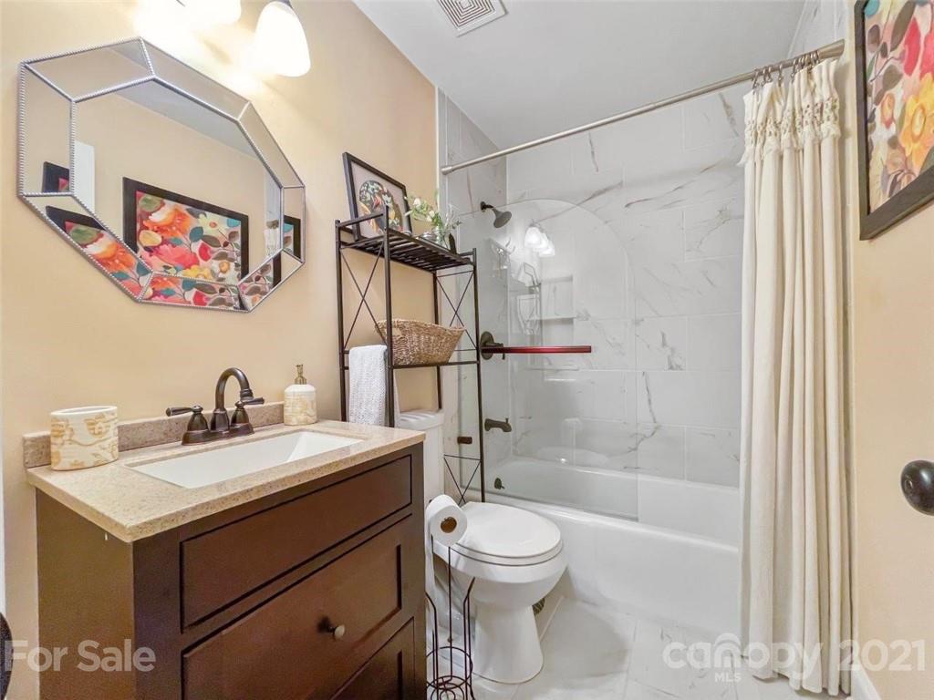 733 Neill Ridge Road Matthews, NC 28105 - Photo 22 of 30 a bathroom with a sink mirror toilet and shower