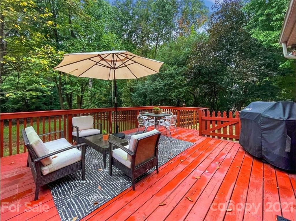 733 Neill Ridge Road Matthews, NC 28105 - Photo 23 of 30 an outdoor sitting area with furniture and wooden deck