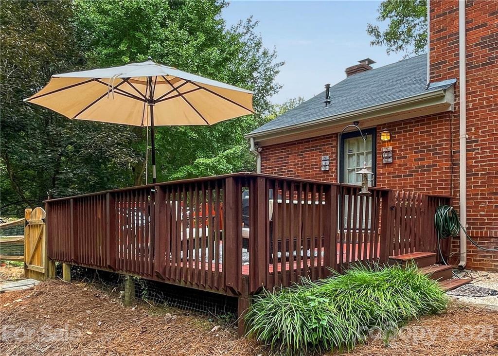 733 Neill Ridge Road Matthews, NC 28105 - Photo 25 of 30 a backyard of a house with wooden fence