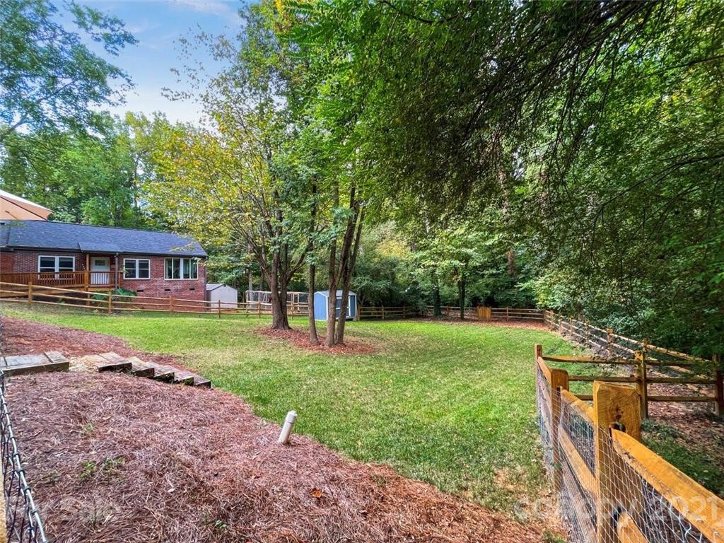 733 Neill Ridge Road Matthews, NC 28105 - Photo 26 of 30 a view of a house with a yard