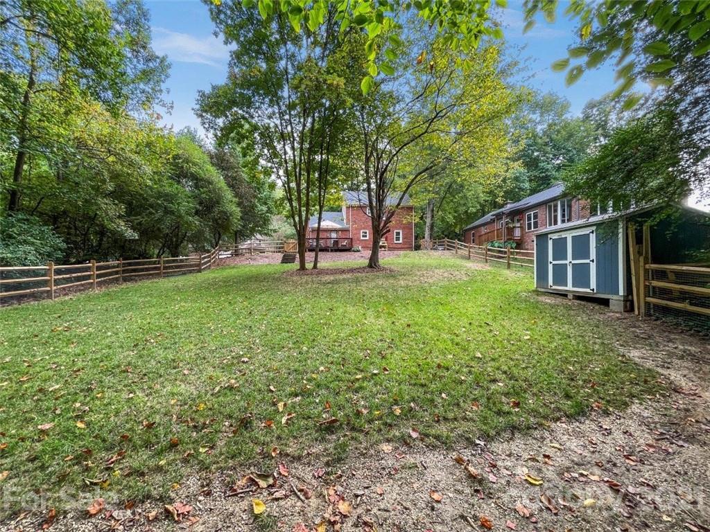 733 Neill Ridge Road Matthews, NC 28105 - Photo 29 of 30 a backyard of a house with table and chairs