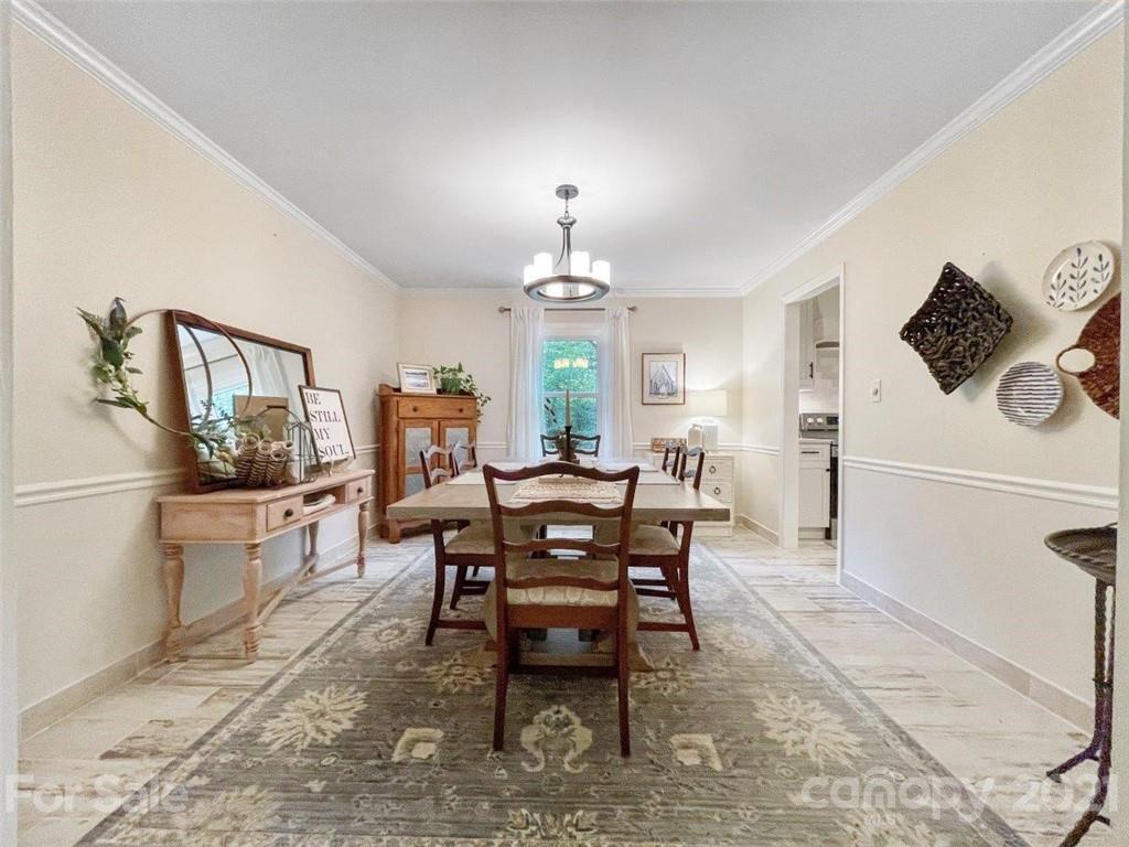 733 Neill Ridge Road Matthews, NC 28105 - Photo 5 of 30 a view of a dining room with furniture window and wooden floor