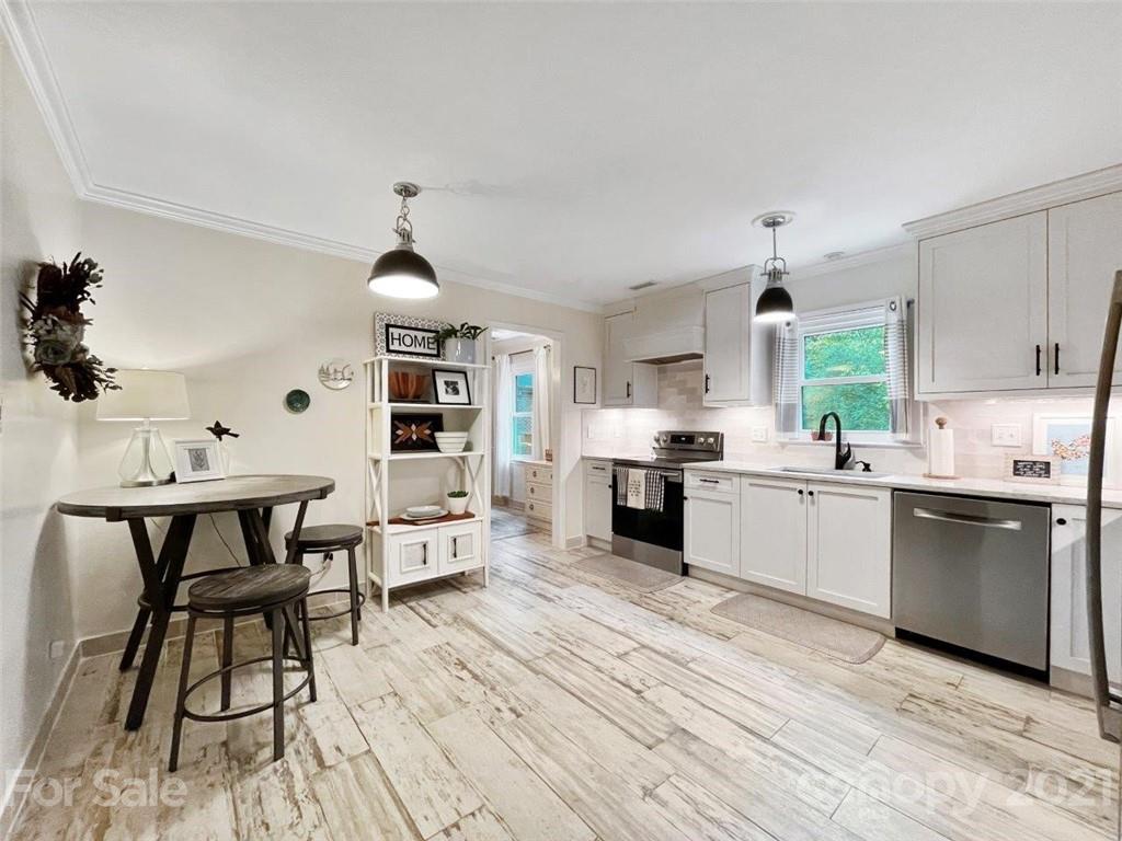733 Neill Ridge Road Matthews, NC 28105 - Photo 9 of 30 a large kitchen with a lot of counter space and a sink