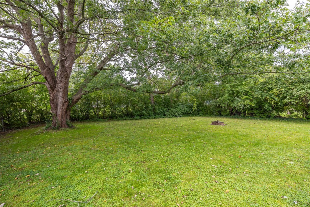 15 Green Ivy Circle Henrietta, NY 14623 - Photo 6 of 33 Private fenced backyard, surrounded by trees.